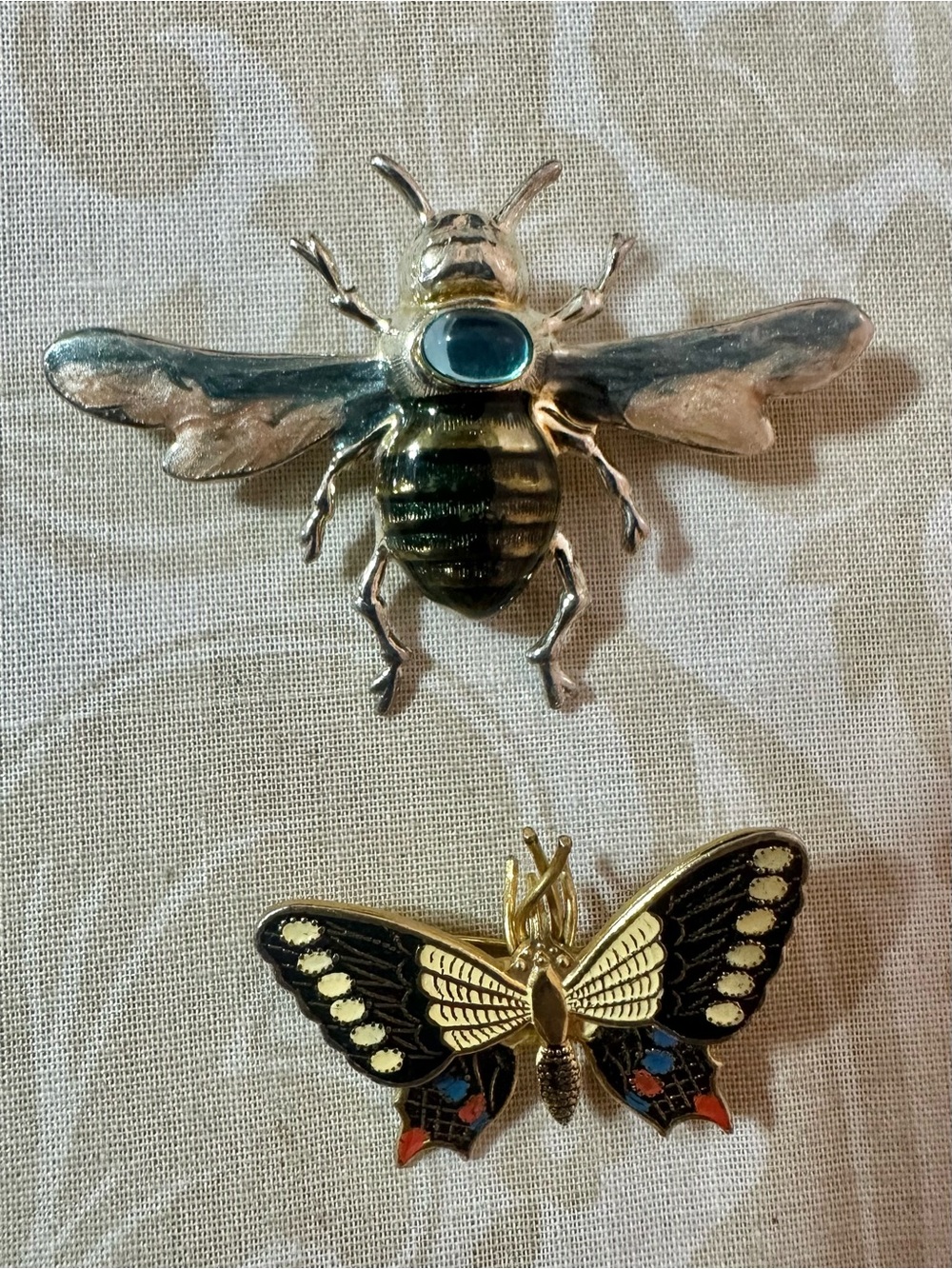 Brass Bee Pin with Blue Accent and a butterfly pin Unbranded